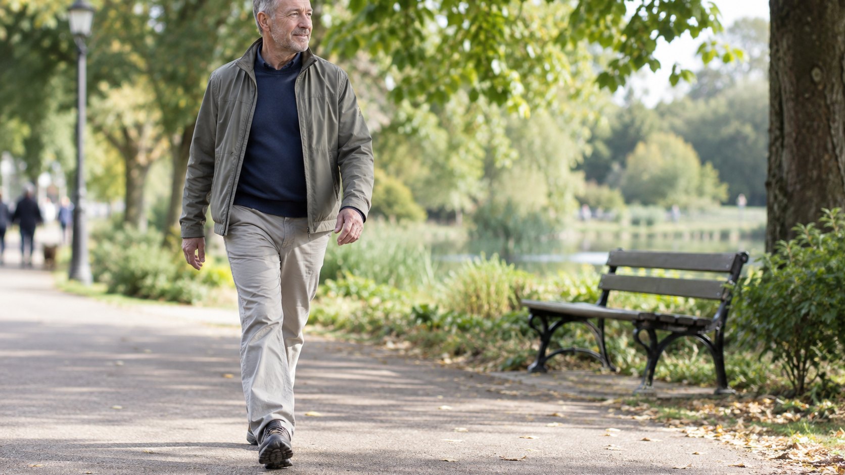 A man takes a relaxed walk on a leafy path after recovering from a mild illness.