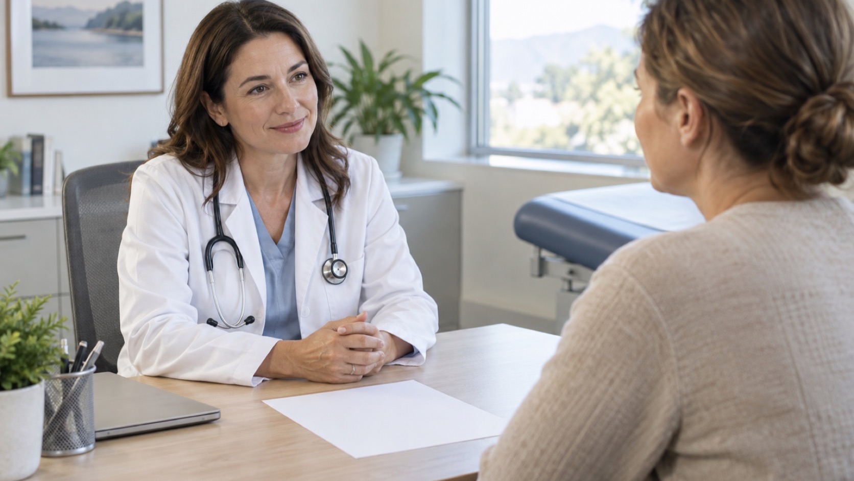 Clinician and adult review a blank paper.